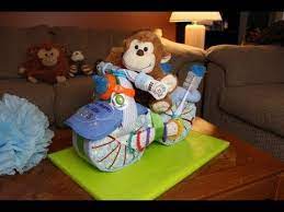Looking For Easy Video Instructions On How To Make A Motorcycle Diaper Cake This Diaper Cake Is Per Diaper Cake Boy Baby Shower Diapers Diaper Motorcycle Cake
