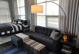Apartment Unusual Studio Apartment Furniture For Small Space With L Shape Dark Grey Bed Studio Apartment Decorating Studio Apartment Furniture Bedroom Design