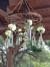 Wagon Wheel Chandelier With Vintage Bottles Wagon Wheel Chandelier Wheel Decor Wagon Wheel Decor