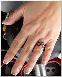 40 Of The Best Wedding Ring Tattoo Designs Ring Tattoo Designs Wedding Band Tattoo Ring Finger Tattoos