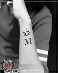 This man has drawn an m and j alphabet tattoo on his own thumb which looks . Black Stain Tattoo Studio Geometric Crown With Alphabet M Artist Tattooist Dharmesh Magra Location Black Stain Tattoo Studio 5 Basement Lake Plaza Nr Chinmay Crystal Opp Vastrapur Lake Vastrapur Ahmedabad Gujrat 380015