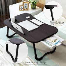 While it serves these purposes, a traditional coffee table can be too low for a comfortable dinner or too hard as a footrest. Buy Lushh Laptop Deskfolding Bed Table Laptop Desk With Ipad And Cup Holder Adjustable Lap Tray Notebook Stand Foldable Watch Moveiies Black Online Shop Home Garden On Carrefour Uae