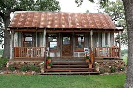 These rustic designs offer modern floor plans with a comfy cabin like archival designs rustic house plan offer modern floor plans with a comfy cabin like exterior. Tin Roof And Front Porch Sitting It Doesn T Get Much Better Than This Old Farm Houses Prefabricated Houses Cabins And Cottages