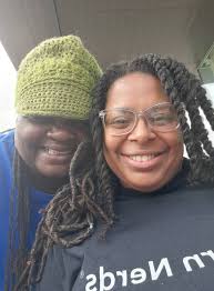 Volunteering with women setting up dwellings