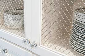 Suitable for all your small organizing needs in the add some functional rustic farmhouse decor to your kitchen with this chicken wire wall 3 storage basket bin. White Kitchen Cabinets With Chicken Wire Insert Traditional Kitchen Indianapolis By Case Design Remodeling Of Indianapolis