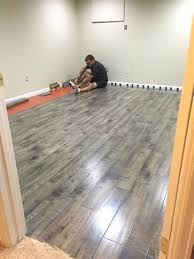 Laminate Flooring In A Basement Basementideasfinished Basement Remodeling Finishing Basement Basement Makeover