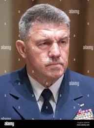 United States Coast Guard Admiral Karl Leo Schultz, Commandant of the Coast  Guard, participates in a briefing with US President Donald J. Trump and  senior military leaders in the Cabinet Room of