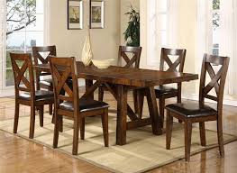 The rich look of the burnished brown finish flows beautifully over the decorative framed details. Montreal Seven Piece Trestle Table And Cross Back Chair Dining Set Sadler S Home Furnishings Dining 7 Or More Piece Set