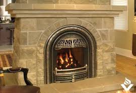 The insert is a decorative cast iron plate produced in a mould. Valor Windsor Arch Fireplace Vancouver Gas Fireplaces