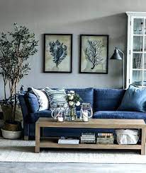 In this living room a navy wall and sofa help to set off the pinks in the cushions rug and artwork. Blue Grey Walls Oak Furniture Grey Walls Full Size Of Living Room Colors Blue Grey Navy Blue Blue Furniture Living Room Blue Sofa Living Blue Sofas Living Room