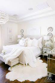 White walls and gray fabric unite to create a peaceful mood in this connecticut bedroom designed by timothy whealon. How To Add Luxury To Your Bedroom Randi Garrett Design