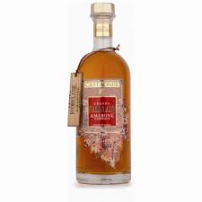 Barrique di grappa come lingotti d'oro. Castagner Fuoriclasse Amarone Barrique