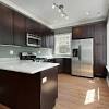 A dramatic, modern, backsplash and a simple flooring solution will make a plus, when you have cabinets that take over an entire wall, the cabinet sizes can vary and create a unique design element to your kitchen. 1