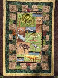 I've sewn with wendi's patterns before and they're so fun, this dinosaur quilt would be such a blast to sew, from shiny happy world. Dinosaurs Quilt Novocom Top