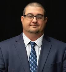 Longtime Oscoda resident and Legendary saxophonist JIM SAPP receives an  AWARD from fellow band mate, Tom Neuenfeldt, during his presentation  ceremony at last Monday's Tawas Community Concert Band's Christmas  performance. Jim has
