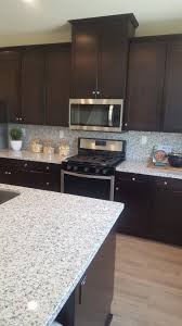 Black And White Granite Countertops Vinyl Plank Flooring Black And White Granite Countertops Dark Tobacco Cabinet Olivewoo Vinyl Plank Flooring Kitchen Colour Schemes White Granite Countertops