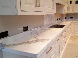 White himalaya marble countertops brighten this stunning black kitchen by april tomlin interiors based in nashville, tennessee. China Statuario Marble Countertop For Kitchen Cabinets Bathroom Vanity Workbench Table Top Solid Surface China Kitchen Countertop Marble Countertop