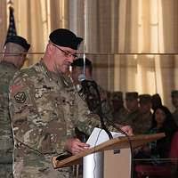 Brig. Gen. Ernest Litynski lights the last ceremonial