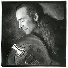 John Campbell was a bundle of contradictions. He wore cowboy boots and  snap-button shirts, but played the blues. Campbell could darken the  brightest day with this remarkable scowl, something deepened by  criss-crossing