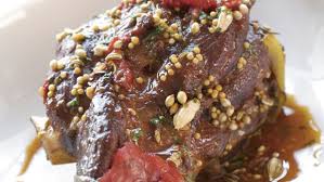 Osso buco is an italian dish of veal shank braised for a really long time in a white wine bone marrow infused sauce originally from lombard. Osso Buco Recipe Recipe Finecooking