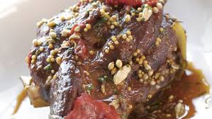 It's a milanese dish of veal shanks braised with wine, vegetables and stock until the meat is falling off the bone. Osso Buco Recipe Recipe Finecooking