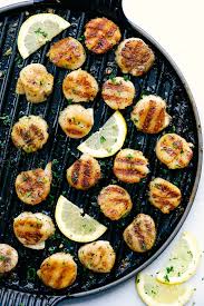 Grilled Lemon Garlic Scallops Is An Eloquent Dish Marinated In The Juices Of A Lemon Hint Of Garlic Wr Easy Grilling Recipes Scallop Recipes Grilled Scallops