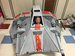 Just cut out a long rectangle of cardboard and bend the middle of it into a handle shape and tape down the ends. A Father Built A Kickass Star Wars Ship Out Of Cardboard For His Daughter The Verge