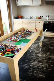 This Table Has A Secret And It S Pretty Awesome Kitchen Table With Storage Lego Table Kitchen Table