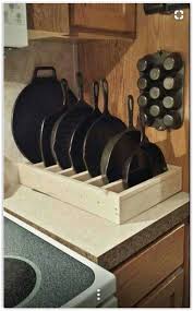 Wood Frying Pan Holder Or Any Pans To Store Them In Your Cupboard They Are Using It For Their Cast Kitchen Organization Diy Kitchen Design Iron Storage