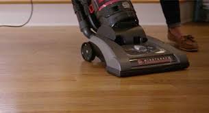 A Person Vacuuming A Hardwood Floor Clean Hardwood Floors Cleaning Wood Floors Hardwood Floors