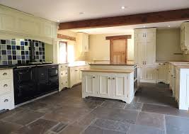 After purging every last trace of dust from your cabinets, place painter's tape along the cabinets' edges to prevent primer and/or paint from leaking into the surrounding areas. Hand Painted Pine Kitchen Pontefract Traditional Painter