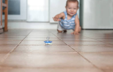 Infants spend up to 80 percent of their awake time within inches of floor surfaces, AI generated