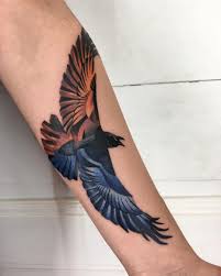 What is to raven tattoos mean? A Flame Colored Raven Tattoo By Mavka Leesova Tattoogrid Net