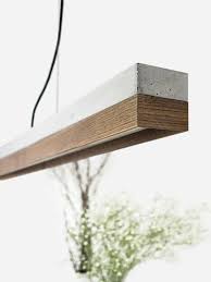 C1 Nut The Rectangular Pendant Lamp C1 Nut Is Cast From A Light Grey Concrete It Combines Modern Nutwood With Rou Concrete Light Concrete Wood Concrete Lamp