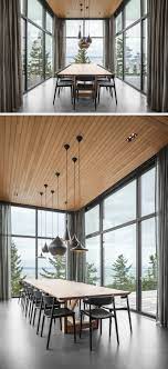 A Dining Room Surrounded By Glass Is Projected Out From The Rest Of This House Minimalist Dining Room Dining Room Design Modern Dining Room