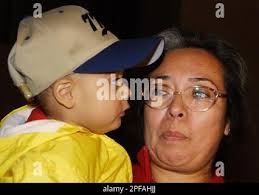 Divora Salazar, mother of 1-year old Amadeo "Felipe" Medina, holds the boy  during a press conference after the child was returned to her Friday, Oct.  4, 2002, in Los Angeles. The boy's father, Amadeo Medina, allegedly  kidnapped the boy and his aunt by ...