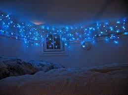 We love the light blue color is a gorgeous farmhouse! I Used To Have Purple Lights Strung Up Like This Around My Ceiling And Doorway Awesome Hang Christmas Lights Decorating With Christmas Lights Christmas Lights