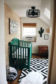 Black And White Rug Kids Room Cactus Themed Boy S Nursery In Black And White With Emerald Green Crib Ikea Rug And Wood Accent Gender Neutral Baby Nursery Baby Boy Nurseries Baby Boy Rooms