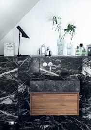 Modern bathroom vanities are the most popular types of cabinets today, offering a stunning modern aesthetic to your bathroom and elevating it from a mundane place to a sanitary showpiece wrought with artistry and functionality. Black Marble In The Bathroom Tile Baths Fixtures Floors Apartment Therapy