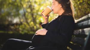 Vector illustration of two young fashionable women having coffee and chatting after shopping together. Stranger Publicly Shames Pregnant Woman For Drinking Coffee