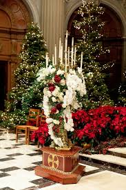 See more ideas about church flower arrangements, church flowers, altar flowers. Church Altar With Red And White Flowers And Lit Christmas Trees