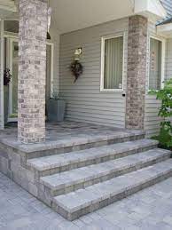 Laying pavers over concrete porch. Covering The Old Front Stoop With Paving Stones Gave This Entryway A Classy New Look Concrete Front Steps Front Porch Steps Stairs Exterior