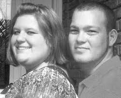 Two hospitalized, car burns after collision