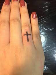 Cross tattoos can be small enough to fit on the small space on your fingers! Pin On I Think Tattoos Are Pretty Cool
