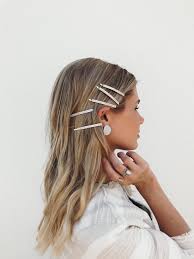Beautiful model with retro hair style bouffant hair and a bushy tail. 90s Hair Accessories Bringing Back The Barettes Barefoot Blonde