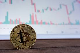 bitcoin gold coin and candlestick chart photo premium download