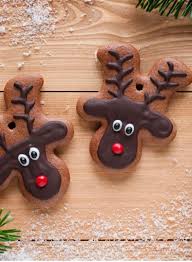 Once your gingerbread men are baked and cooled, flip them upside down and add the fondant red nose, white and black fondant eyes and get creative with writing icing to create the ears and antlers. Top Tips For Making Christmas Hampers On A Budget Christmas Baking Gingerbread Reindeer Christmas Cookies Decorated