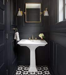 Would You Or Wouldn T You A Black Bathroom Makes A Bold Statement But This Pairing Of Black Gold A Small Toilet Room Powder Room Remodel Powder Room Decor