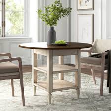 It features drop leaf sides and rolling wheels, ensuring considerable functionality. Kelly Clarkson Home Baleine Drop Leaf Dining Table Reviews Wayfair