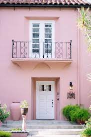 Bright bedroom rattan bed blue pink pillows artwork plant rug. Trend Alert Pink For Exterior